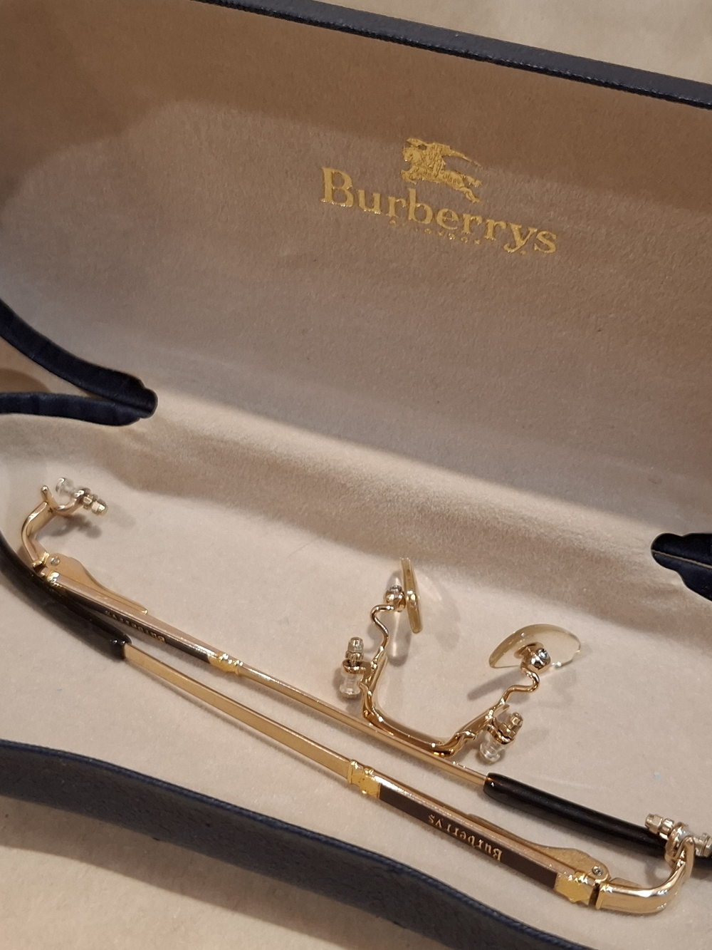 Burberrys Gold Rimless Eyeglass Frame with Black Temples